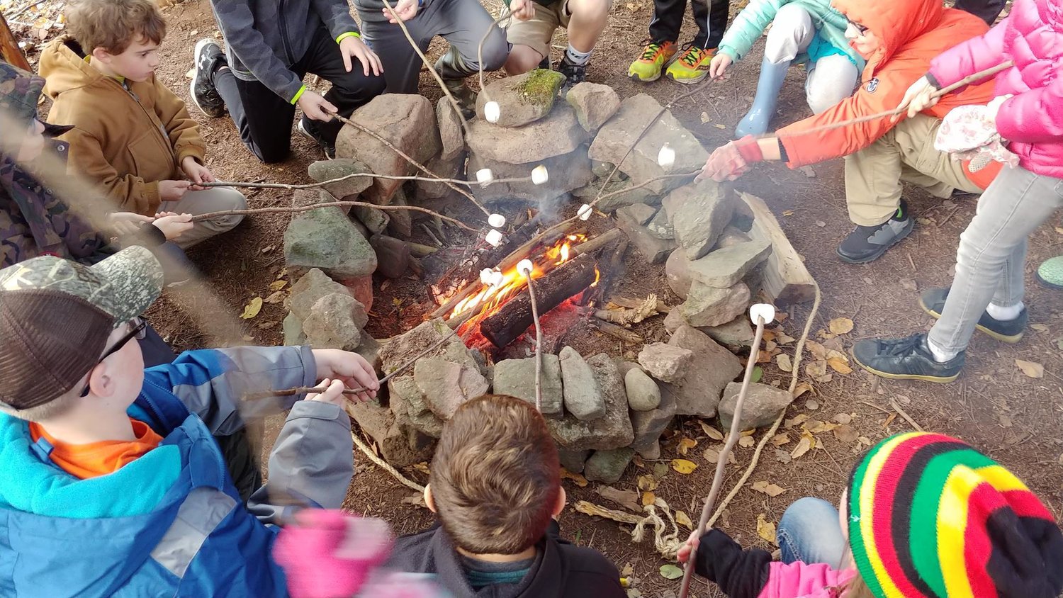 Gathering around a campfire is a quintessential component of most forest school programs.